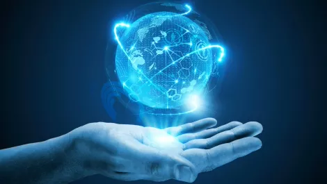 Hand holding globe